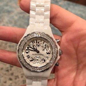Lady’s TechnoMarine white ceramic diamond watch.